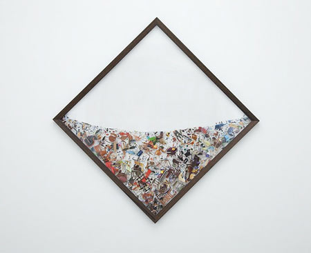 Photographic collages suspended in plexiglas