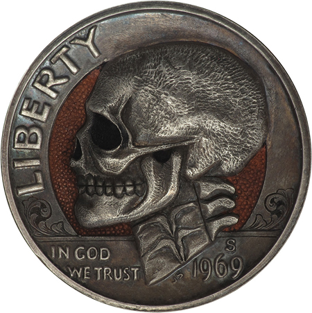 Hobo nickels carved from clad coins