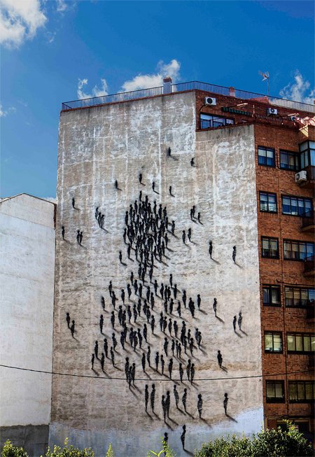 Figures congregate on a building in Spain