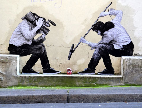 Humourous street art by Levalet in the street of the Paris