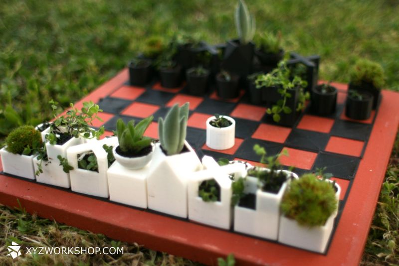 A chess board that uses 3D printed micro-planters as pieces