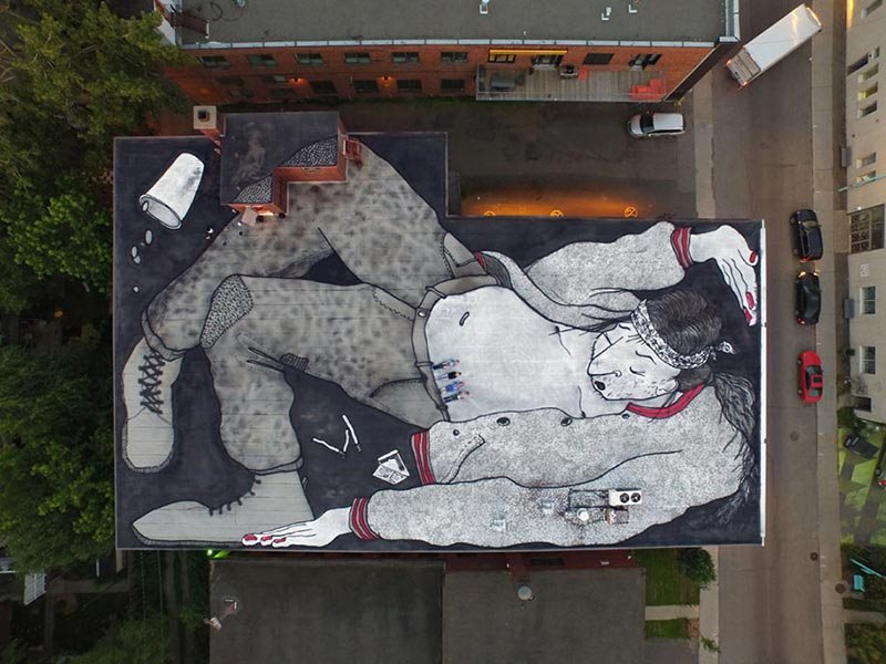 Gigantic street art on rooftops in France