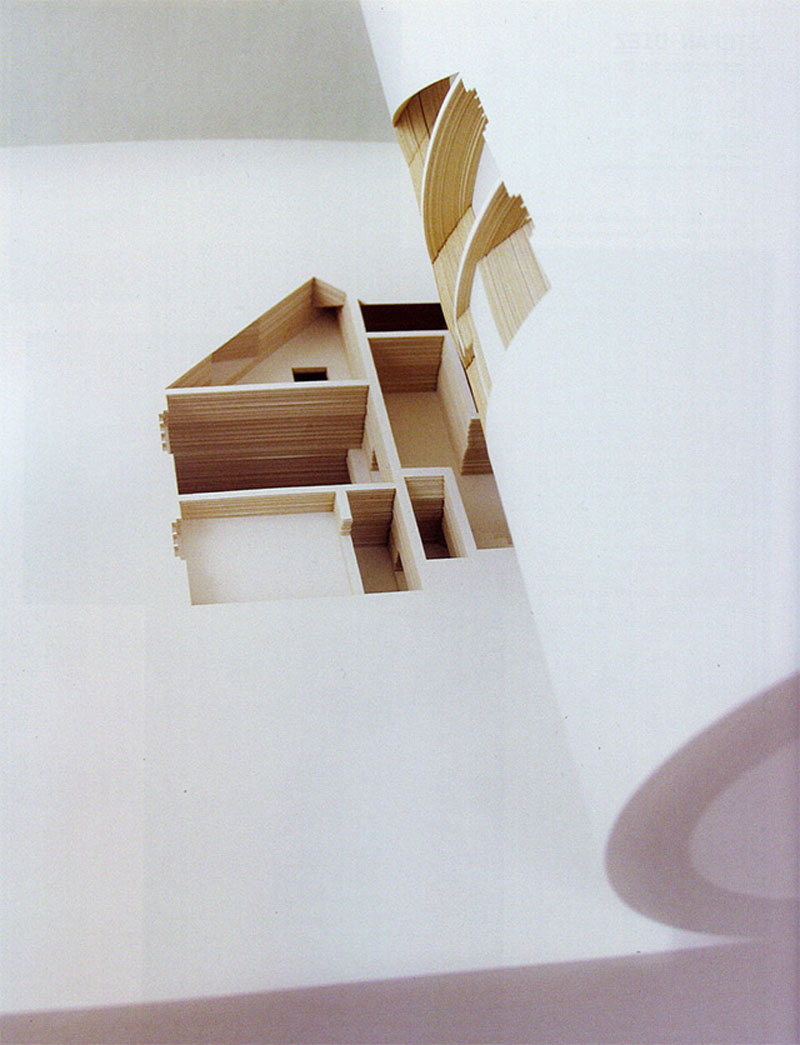 A concept art book that features a paper cutted house