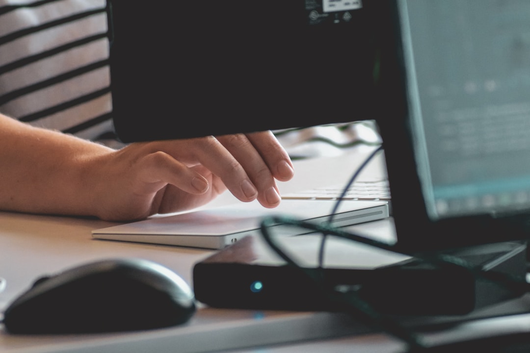 Employee using a compliant HIPAA fax service on a desktop computer